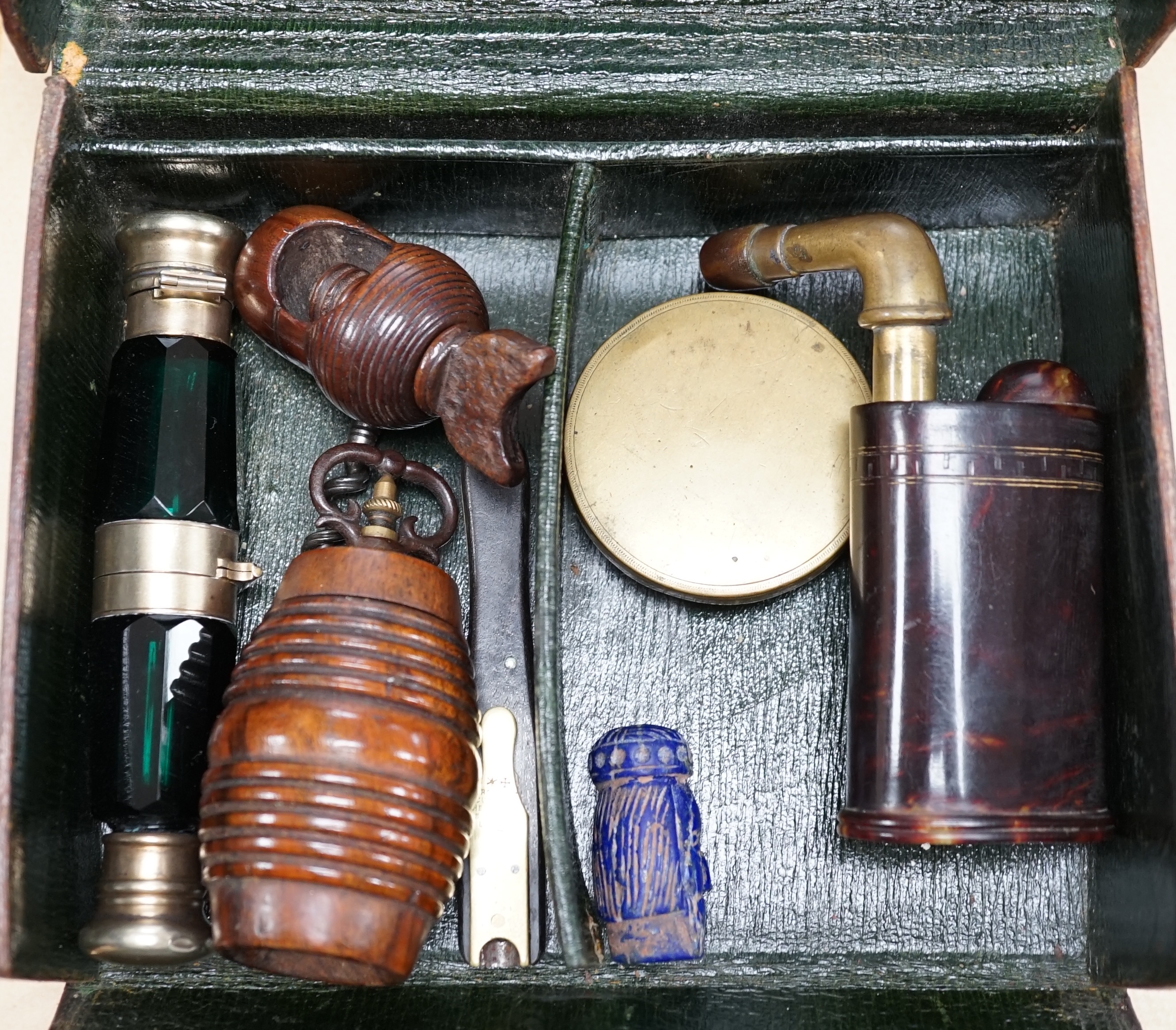 A pocket sundial, a nut cracker, a nutmeg grater, two double ended scent bottles etc., in a leather case, scent bottle 13cm long. Condition - good